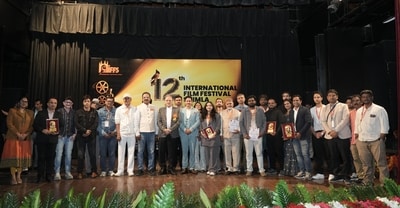 Himachal Pradesh governor Kavinder Gupta (in chequered blazer) with filmmakers and organisers of the 12th International Film Festival of Shimla. (HT photo)