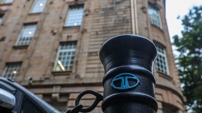 The Tata Group logo is displayed on a pedestrian safety pole near Bombay House, the Tata Group headquarters building, in Mumbai. (Representative Image/Bloomberg) The Tata Group logo is displayed on a pedestrian safety pole near Bombay House, the Tata Group headquarters building, in Mumbai. (Representative Image/Bloomberg)