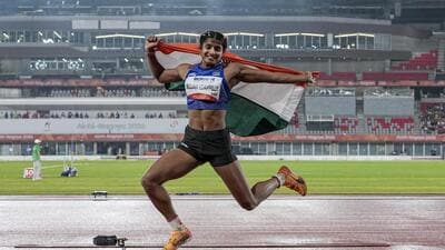 India's Ancy Sojan celebrates after winning silver medal in the women's long jump final event at the ongoing 20th Asian Games, in Nagoya, Japan. (PTI) India's Ancy Sojan celebrates after winning silver medal in the women's long jump final event at the ongoing 20th Asian Games, in Nagoya, Japan. (PTI)