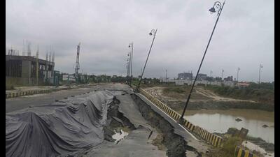 Large stretch of road caved in near Ekana Stadium following three days of continuous rainfall in Lucknow on Sunday. (Deepak Gupta/HT)