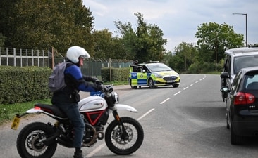 Police blocked a road while posted outside RAF Fairford base in Fairford, south-west England on September 27, 2026, as UK counter-terrorism police investigate an incident near the base in the village of Whelford. (AFP) Police blocked a road while posted outside RAF Fairford base in Fairford, south-west England on September 27, 2026, as UK counter-terrorism police investigate an incident near the base in the village of Whelford. (AFP)