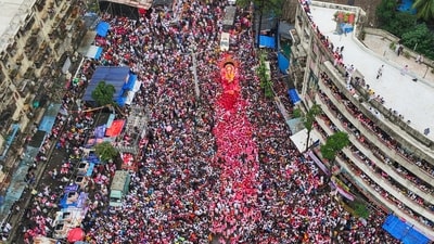People take part in a Ganesh visarjan procession in Mumbai. (PTI) People take part in a Ganesh visarjan procession in Mumbai. (PTI)