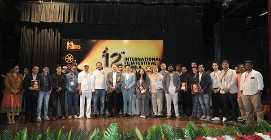 Himachal Pradesh governor Kavinder Gupta (in chequered blazer) with filmmakers and organisers of the 12th International Film Festival of Shimla. 