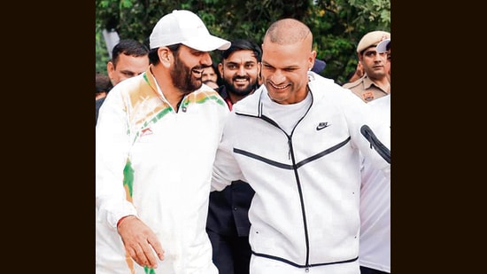 Haryana CM Nayab Singh Saini with former cricketer Shikhar Dhawan during the marathon in Faridabad on Sunday. (Sourced)
