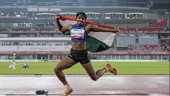 India's Ancy Sojan celebrates after winning silver medal in the women's long jump final event at the ongoing 20th Asian Games, in Nagoya, Japan. (PTI)