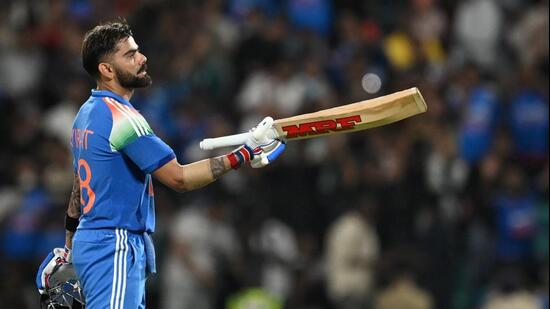 India's Virat Kohli celebrates after scoring a century during the first ODI against West Indies at the Greenfield International Stadium in Thiruvananthapuram. (AFP)