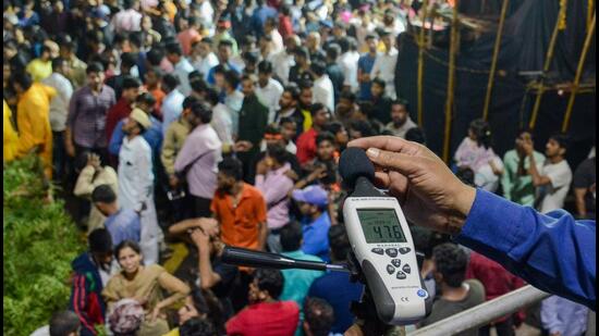 Pune, India - Sept. 12, 2019:Official from Maharashtra Pollution Control Board recorded a noise level during the Ganpati immersion procession at Vishrambag chowk in Pune, India, on Thursday, September 12, 2019. (Photo by Milind Saurkar/Hindustan Times) (Milind Saurkar/HT Photo)