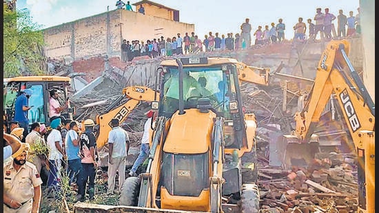 Rescue operation underway after a three-story under-construction building collapsed at Dhulkot village, in Ambala on Sunday. (ANI Video Grab)