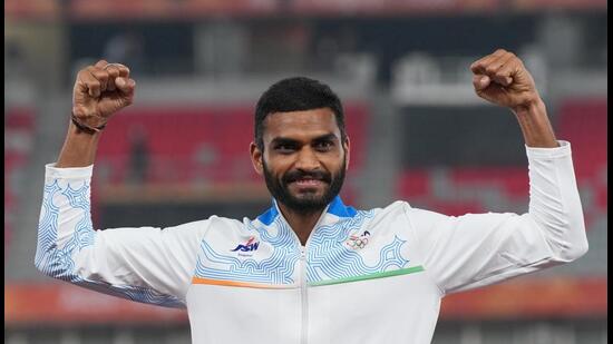 Silver medalist India's Sarvesh Kushare Anil celebrates during the medal ceremony of the men's high jump final at the Asian Games in Nagoya, Japan, Sunday. (AP Photo/Mark Baker)