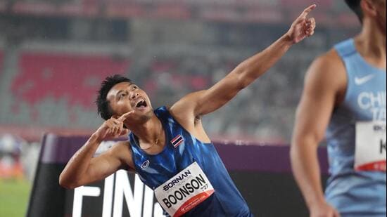 Thailand's Puripol Boonson celebrates after wining the men's 200m final at the Asian Games in Nagoya, Japan. (AP Photo/Mark Baker)