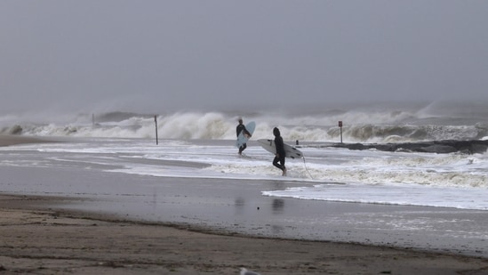 Surfers turn out at Rockaway Beach as a Nor'easter storm brings large waves to area beaches on September 27, 2026, in New York City. New York City and much of the Northeast are experiencing a weekend of high winds, rain, and flooding in numerous coastal communities as the storm passes through. (Getty Images via AFP)