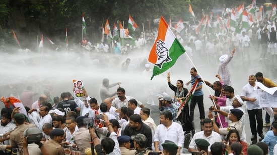 Police use water cannons to stop the Bihar Pradesh Congress Committee members and supporters during a protest march in Patna.