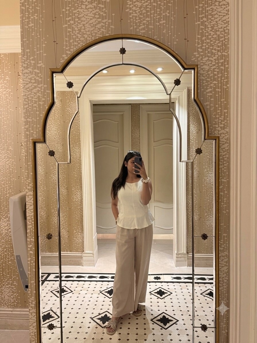 A sleeveless peplum silhouette, wide-leg linen, and soft slides: proving that effortless comfort and luxury can co-exist. A sleeveless peplum silhouette, wide-leg linen, and soft slides: proving that effortless comfort and luxury can co-exist.