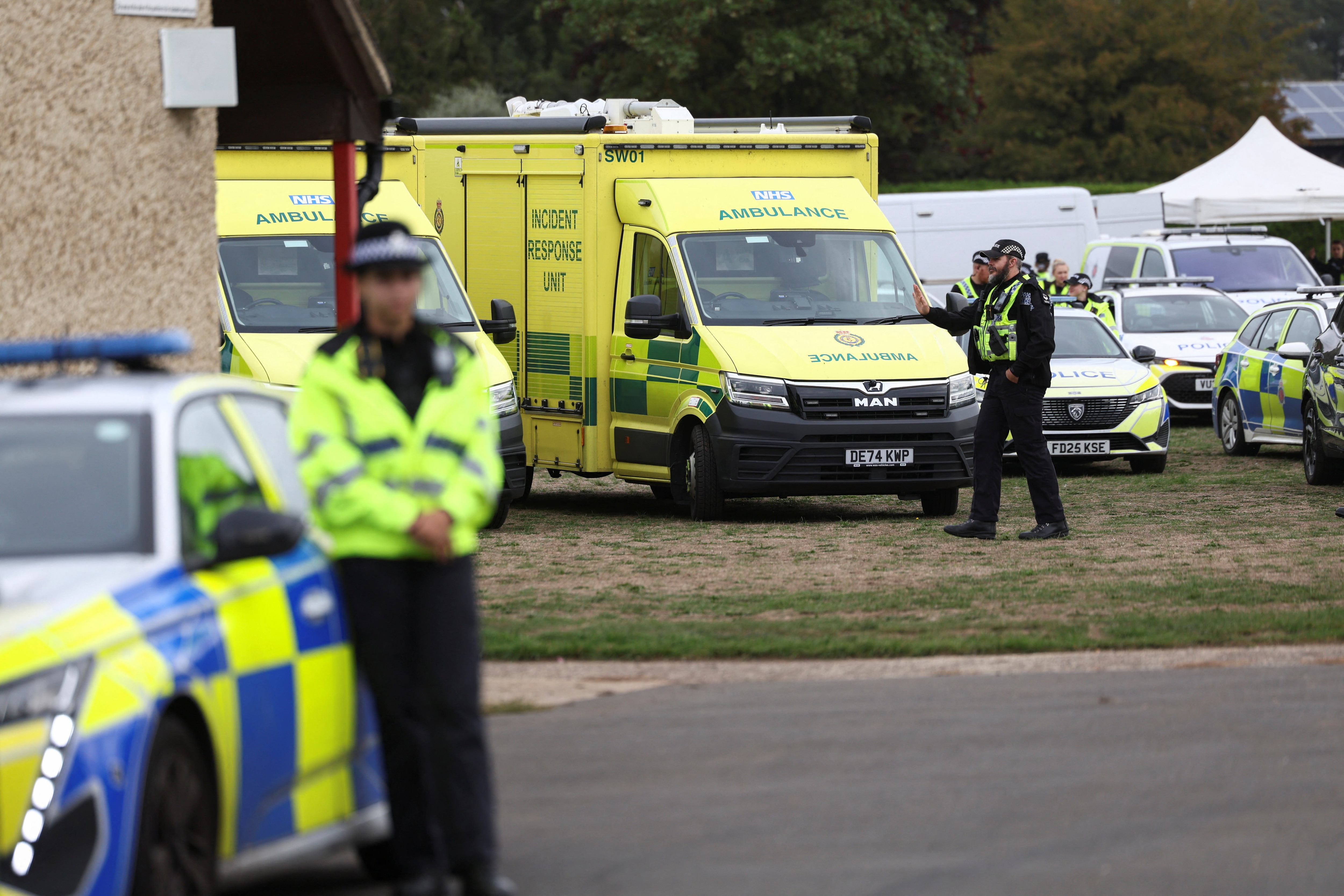 Emergency vehicles are parked at Fairford Youth Football club, near RAF Fairford, which hosts US Air Force personnel, in Fairford, Gloucestershire