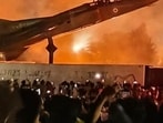A protester atop a decommissioned MiG aircraft installed on the LPU campus on Sunday. (HT Photo)