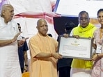 Chief minister Yogi Adityanath at the ceremony where appointment letters were distributed to gram panchayat officers selected through the Uttar Pradesh Subordinate Services Selection Commission, in Lucknow on Monday. (PTI PHOTO)