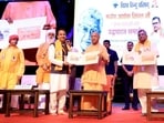Chief minister Yogi Adityanath at the inauguration of the Ashok Singhal birth centenary celebrations in Lucknow on Sunday. (Deepak Gupta/HT)