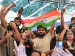 Abhijeet Dipke, with supporters, celebrates at Delhi's Jantar Mantar after education minister Dharmendra Pradhan resigned.(PTI)