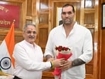 Former WWE wrestler Khali with Himachal Pradesh governor Kavinder Gupta at Lok Bhavan in Shimla on Sunday. (Deepak Sansta)