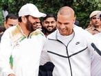 Haryana CM Nayab Singh Saini with former cricketer Shikhar Dhawan during the marathon in Faridabad on Sunday. (Sourced)