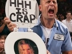 Triple H remembered longtime fan Rick “Sign Guy” Achberger after his death at 54.(Triple H | Instagram)