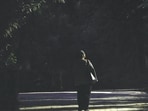 A deserted and poorly lit walking path inside of Qudsia Park. 