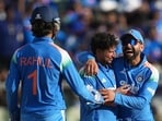 India's Kuldeep Yadav, centre, celebrate the wicket of West Indies Jewel Andrew. (AP Photo/Rafiq Maqbool)