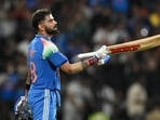 India's Virat Kohli celebrates after scoring a century during the first ODI against West Indies at the Greenfield International Stadium