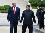 (FILES) North Korea's leader Kim Jong Un and US President Donald Trump cross south of the Military Demarcation Line that divides North and South Korea, after Trump briefly stepped over to the northern side, in the Joint Security Area (JSA) of Panmunjom in the Demilitarized zone (DMZ) on June 30, 2019. South Korea's defence ministry said August 17, 2026 that its joint military exercise with the United States has started after President Donald Trump's announcement it would be scaled back. Trump said he was "not happy" about US participation in the joint military exercises and is scaling back the drills aimed at deterring rival North Korea.