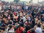 Students of Lovely Professional University (LPU) stage a protest and block the Jalandhar-Phagwara National Highway outside the campus over claims that a female student was raped on the university premises, near Phagwara, Punjab.(PTI)