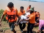 SDRF personnel conduct a rescue operation at a flood-affected area of Surali village in Koraput, Odisha.(PTI)