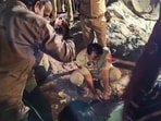 Police personnel and others conduct a rescue operation after a three-year-old girl fell into a nearly 200-foot-deep borewell while playing at Seehi village, in Faridabad, Haryana.
