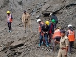 Rudraprayag: Rescue and disaster management personnel clear debris and boulders to restore the damaged Kedarnath pedestrian trek route following a landslide near the Chirbasa helipad, in Rudraprayag district, Uttarakhand on Monday. (PTI)