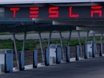 Tesla stock could face pressure if rising oil prices trigger inflation and an S&P 500 downturn. 