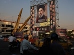 Missiles are displayed next to a banner of Iran's supreme leader, Mojtaba Khamenei, in Tehran.