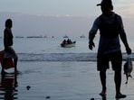 Fishermen unload their catch in Manta, where income from fishing is often just a few hundred dollars a month.