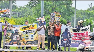 Bike-taxi riders protesting at the Tribune Chowk in Chandigarh on Monday. (Ravi Kumar/HT)