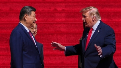 President Donald Trump, right, speaks with China's President Xi Jinping on the steps of the National Archives Museum, Friday, Sept. 25, 2026, in Washington. 