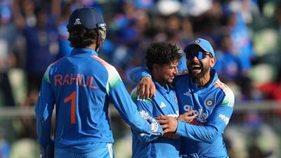 India's Kuldeep Yadav, centre, celebrate the wicket of West Indies Jewel Andrew. (AP Photo/Rafiq Maqbool)