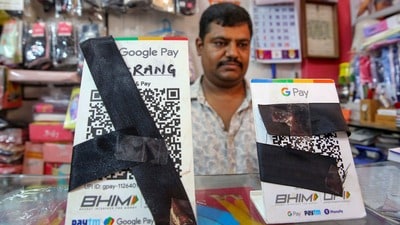 Bhopal: A shopkeeper covers QR codes with black ribbons in the wake of the implementation of Merchant Discount Rate (MDR) for UPI transactions, in Bhopal, Wednesday, Sept. 23, 2026. (PTI Photo) (PTI09_23_2026_000208B) (PTI) Bhopal: A shopkeeper covers QR codes with black ribbons in the wake of the implementation of Merchant Discount Rate (MDR) for UPI transactions, in Bhopal, Wednesday, Sept. 23, 2026. (PTI Photo) (PTI09_23_2026_000208B) (PTI)