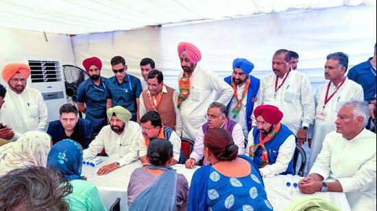 BJP national president Nitin Nabin (sitting third from left), party national general secretary Tarun Chugh, state unit chief Kewal Singh Dhillon, his predecessor Sunil Jakhar, and Rajya Sabha member Raghav Chadha interacting with victims and families affected by drug abuse during the launch of the Nasha Mukt Punjab Yatra at Madhopur in Pathankot district on September 18. (File photo)