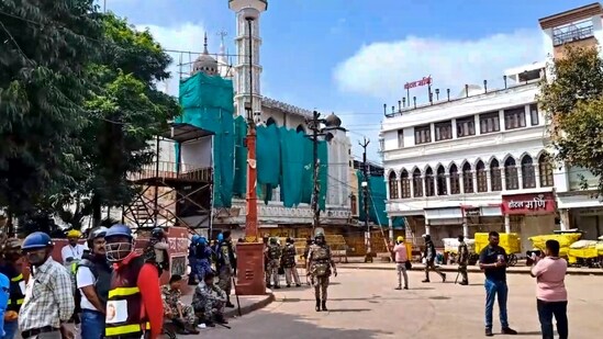 Security personnel keep vigil following stone-pelting incidents during protests against the proposed removal of a portion of the 'Shahi Masjid' for road widening, in Ujjain, Madhya Pradesh, Monday.