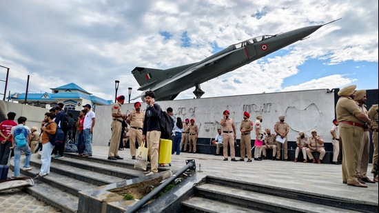 Punjab Police personnel stand guard at the Lovely Professional University (LPU) campus as students depart for their hometowns, in Phagwara on Monday. (PTI)