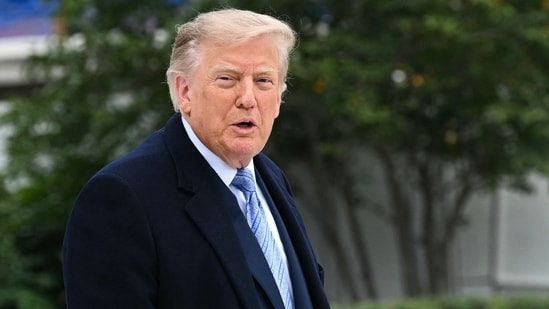 President Donald Trump announces a new steel plant in Iowa at the Oval Office. (AFP)