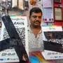 Bhopal: A shopkeeper covers QR codes with black ribbons in the wake of the implementation of Merchant Discount Rate (MDR) for UPI transactions, in Bhopal, Wednesday, Sept. 23, 2026. (PTI Photo) (PTI09_23_2026_000208B)