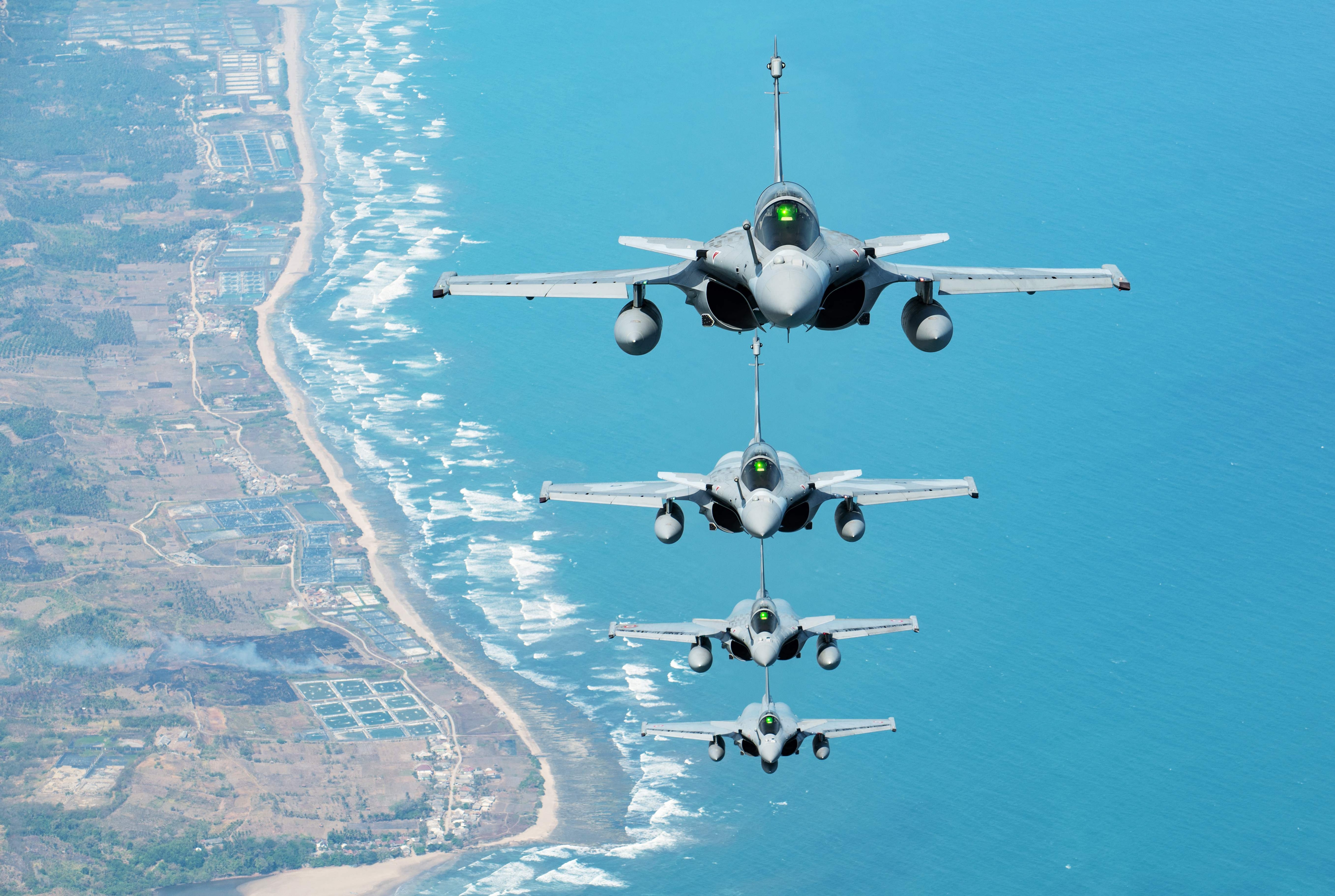 French and Indonesian Rafale fighter jets flying in formation over Indonesia as part of the French Air and Space Force's Pegase 26 mission. (AFP)