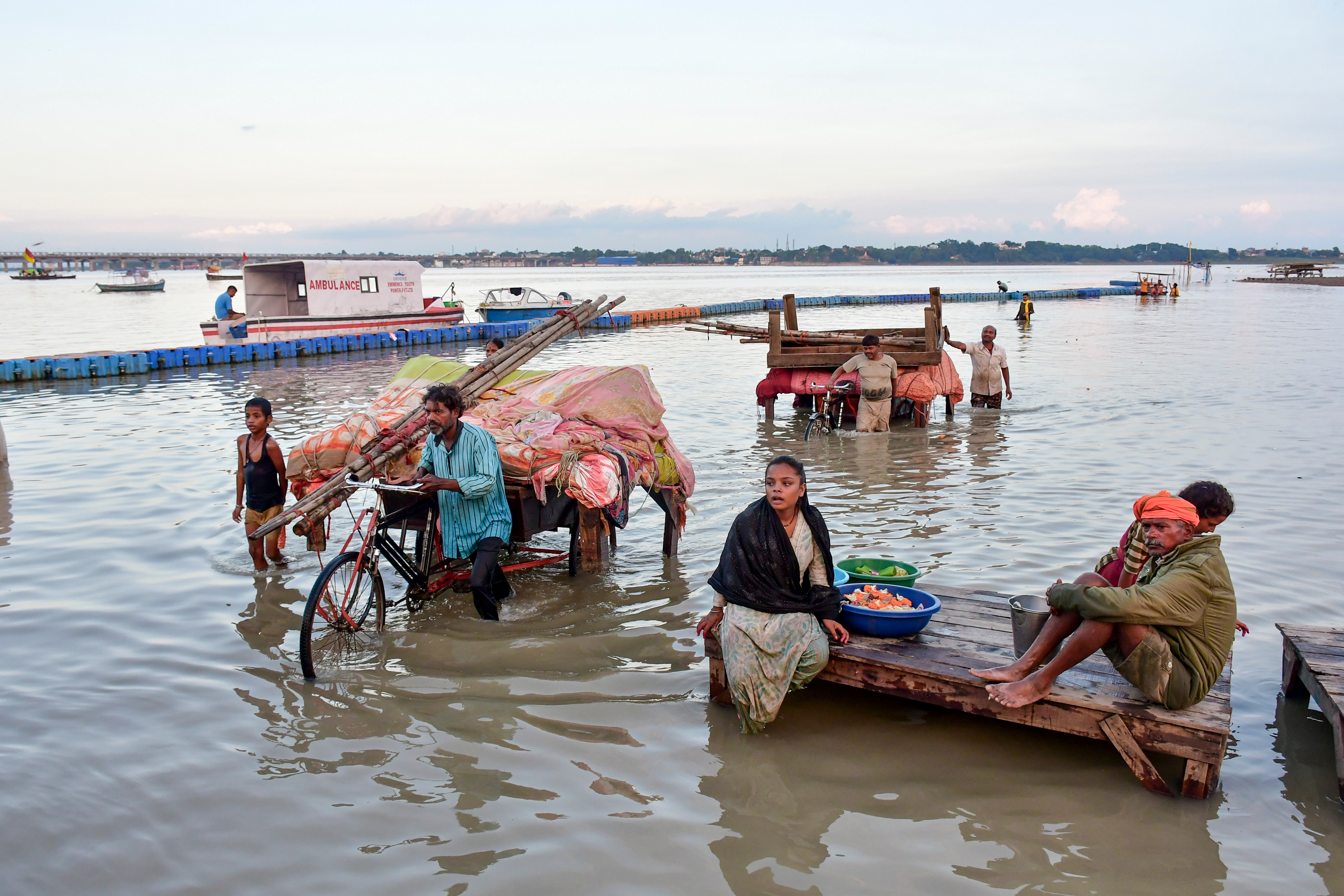 Prayagraj: People carry their belongings to safer places along the banks of the Sangam as the water level rises following heavy rain, in Prayagraj, Uttar Pradesh, Sunday, Sept. 27, 2026. (PTI Photo)(PTI09_27_2026_000489B) (PTI) Prayagraj: People carry their belongings to safer places along the banks of the Sangam as the water level rises following heavy rain, in Prayagraj, Uttar Pradesh, Sunday, Sept. 27, 2026. (PTI Photo)(PTI09_27_2026_000489B) (PTI)