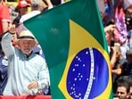 Brazil's President and presidential candidate Luiz Inacio Lula da Silva waves a national flag during a campaign rally in Sao Paulo, Brazil, on September 26, 2026.