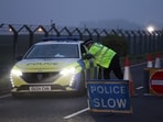 A police officer guards an area as roadblocks remain in place near RAF Fairford airbase. 