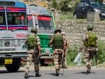 CISF and Jammu & Kashmir Police conduct checking and surveillance at a transit checkpoint.